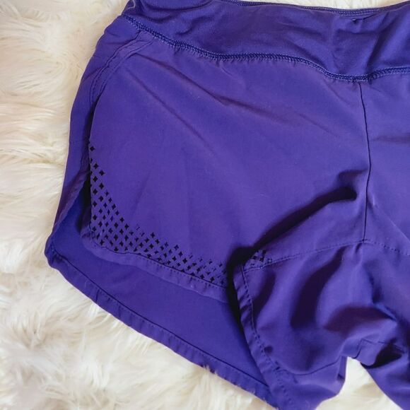 Athleta laser cutout hem purple 3" running shorts - Picture 9 of 10